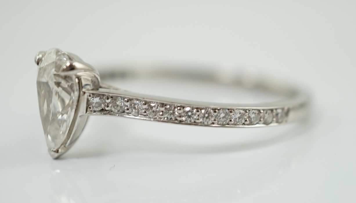 A recent Boodles platinum and single stone pear cut diamond set Harmony design ring, with diamond chip set shoulders and setting